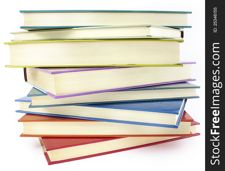 Pile of color hardcover books over white background. Pile of color hardcover books over white background