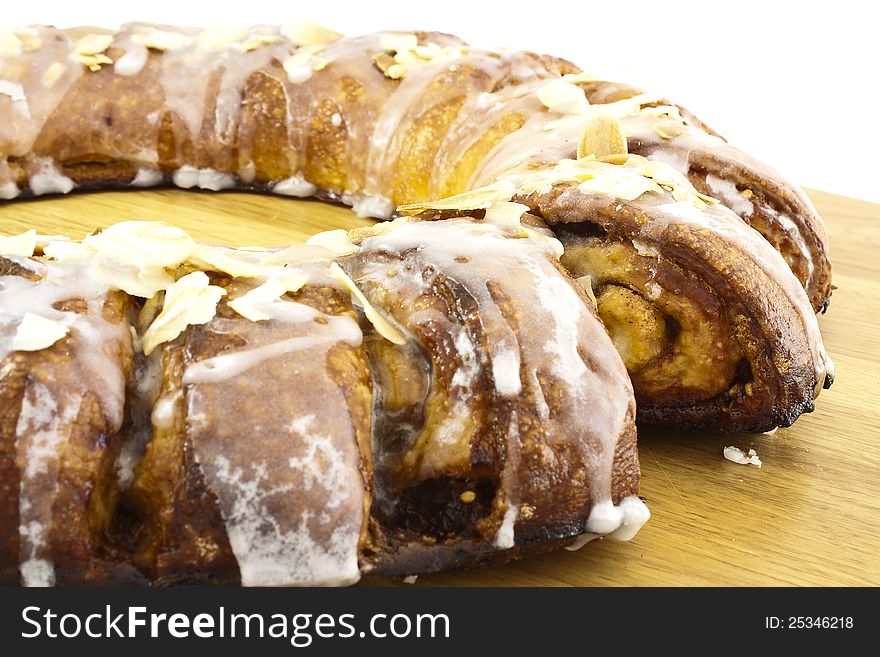 Roll cake of caramel with almond and sugar glass