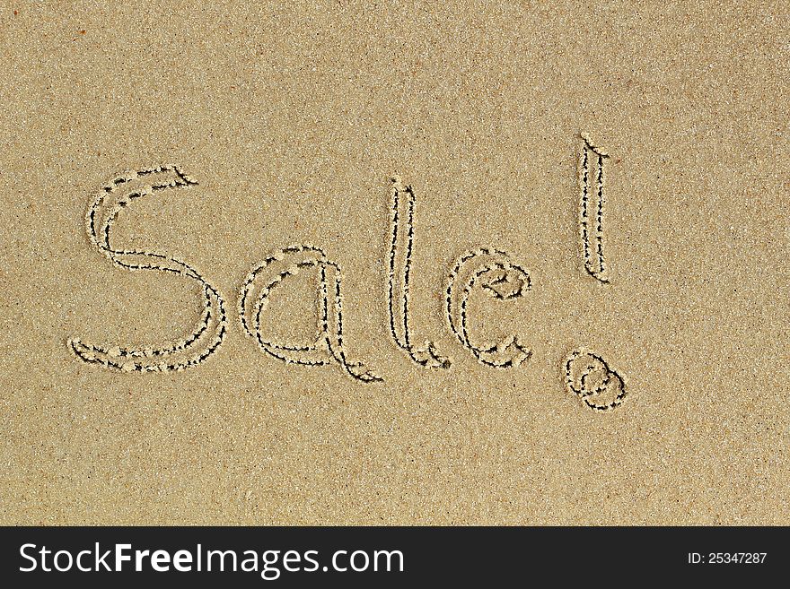 Sale word hand written with exclamation on sand in a beach - a communication message to consumers about discount available on shopping. Sale word hand written with exclamation on sand in a beach - a communication message to consumers about discount available on shopping