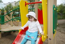 Cute Little Girl Prepares For Rolling At Slide Royalty Free Stock Photography Cute Little Girl Prepares For Rolling At Slide Royalty Free Stock Photography