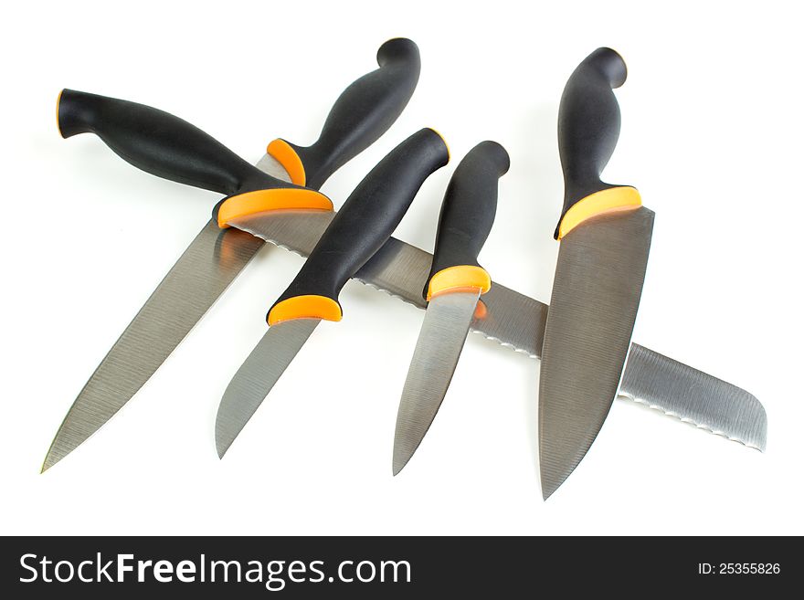 Kitchen knives arrangement, white background with shadow