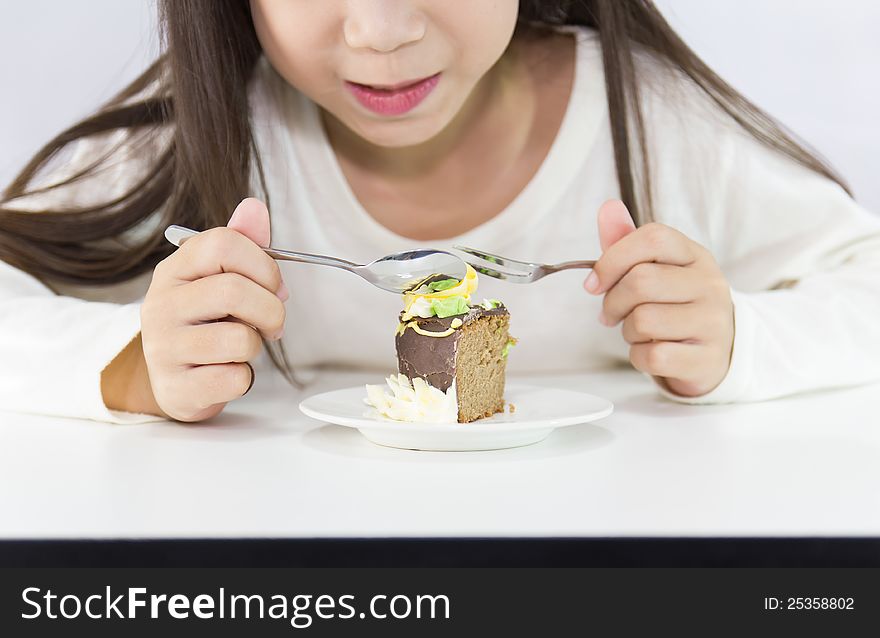 Girl eating cake. on white background