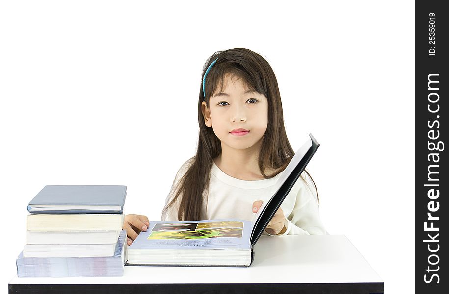 The young student reading the book on a white background