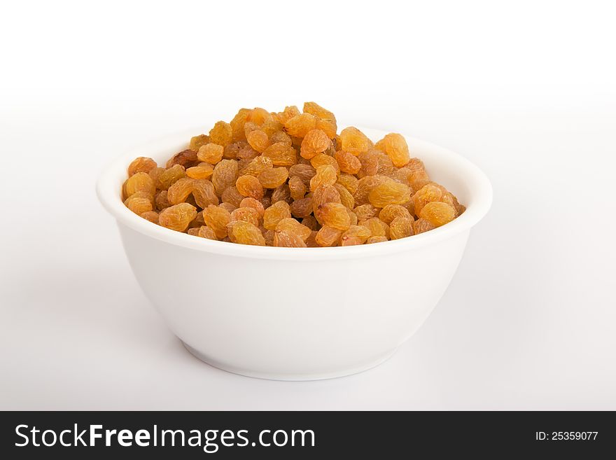 Pile of raisins or black currant   on a white background