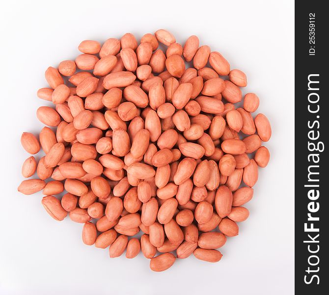 Collection of red groundnuts pods on white background