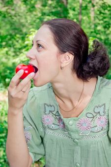 A Woman With A Tomato Royalty Free Stock Photo A Woman With A Tomato Royalty Free Stock Photo
