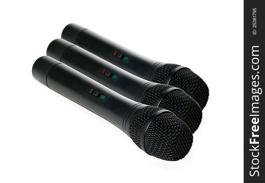 Black microphones on a white background. Black microphones on a white background