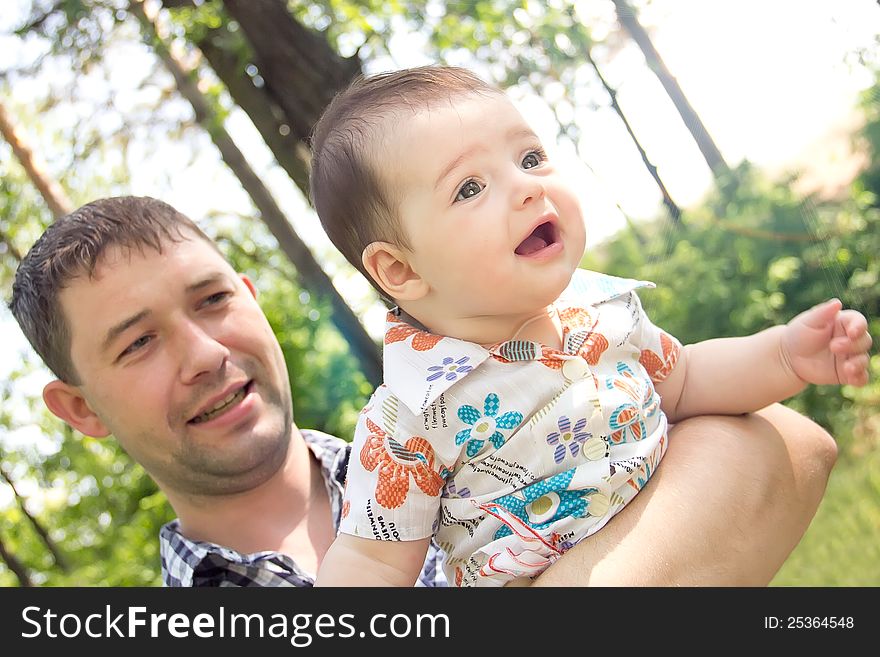 Young Father With A Charming Baby