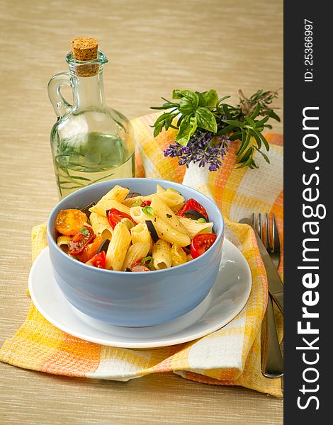 Penne pasta with cherry tomatoes and basil. Penne pasta with cherry tomatoes and basil