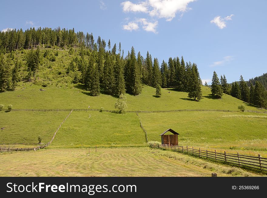 Mountain cottage in the middle of the forest on high mountain in Maramures land of Romania. Mountain cottage in the middle of the forest on high mountain in Maramures land of Romania