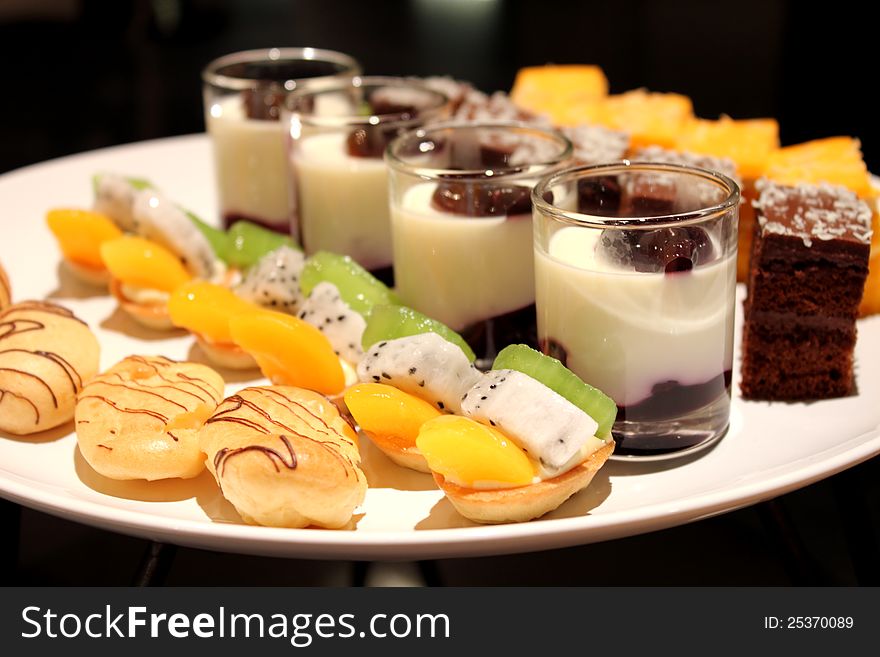 The assorted miniature decorative desserts