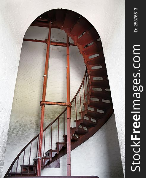 Part of a spiral staircase seen through an opening inside the Cape Hatteras lighthouse. Part of a spiral staircase seen through an opening inside the Cape Hatteras lighthouse