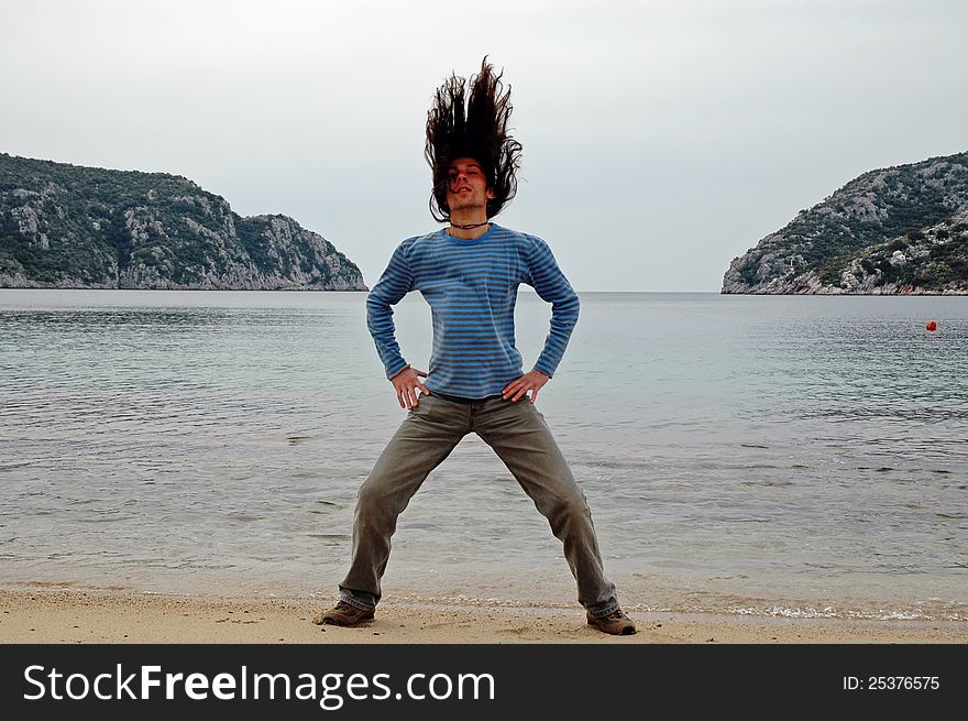 Man With Long Hair On The Beach