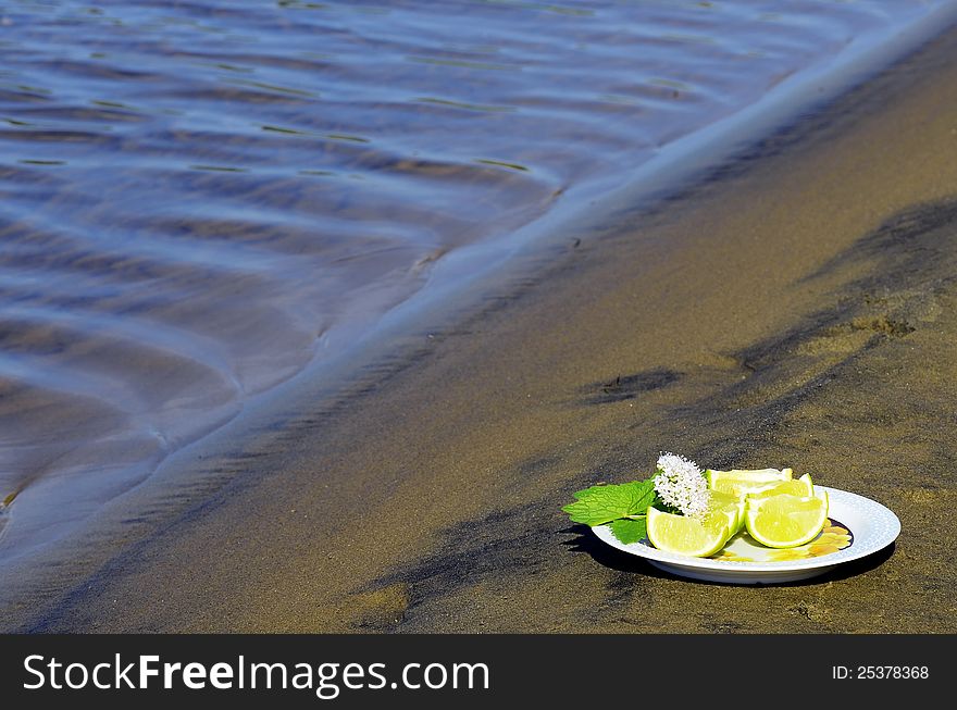 Lime Wedges on a plate at the beach