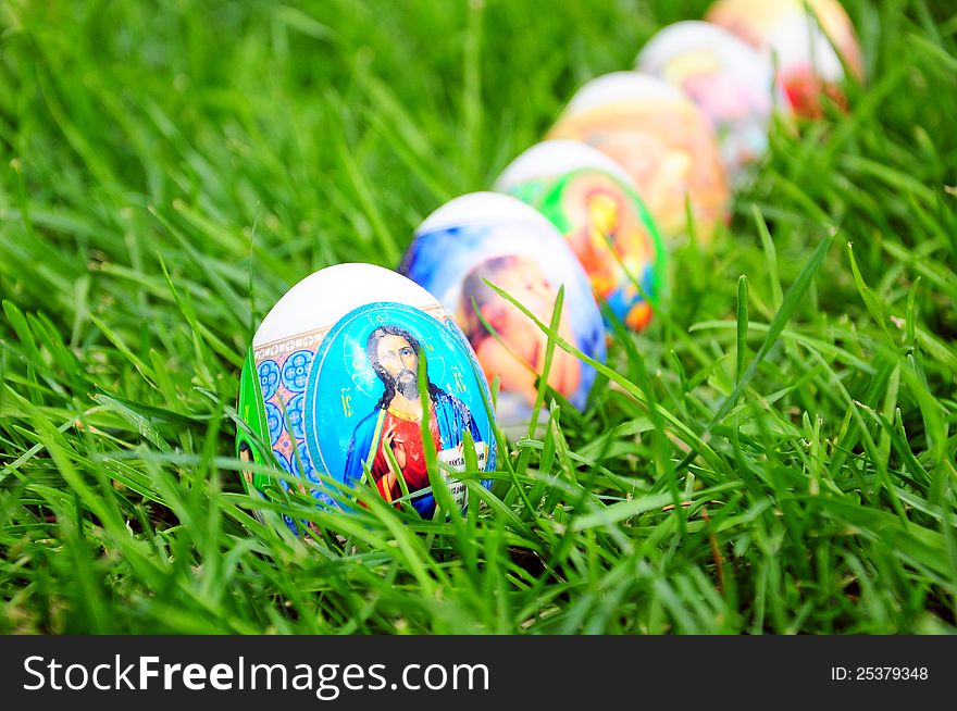 Colorful decorated easter eggs on grass