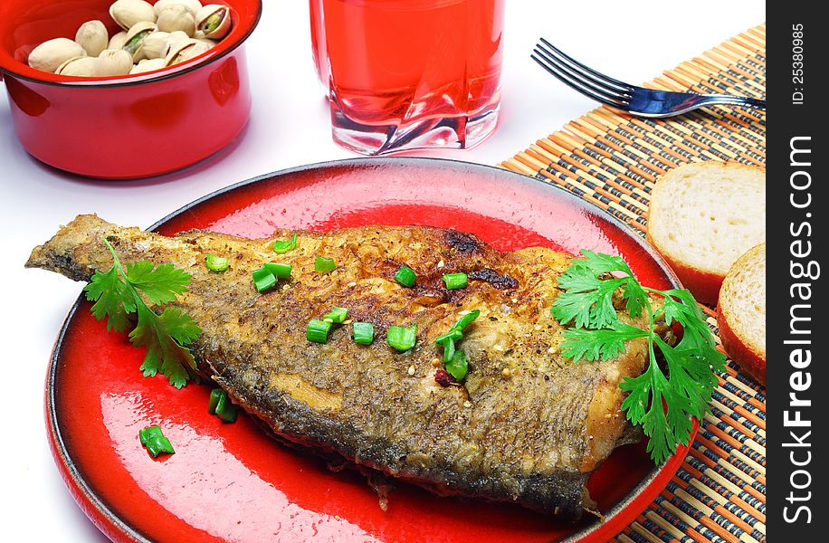 Dish of fried fish with fresh herbs