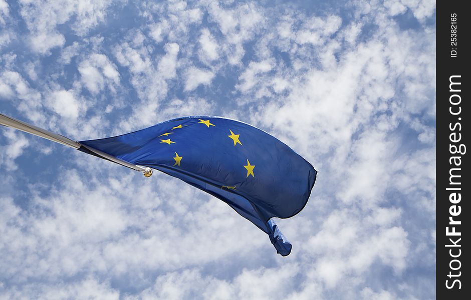 Flag of the european union in front of the deep blue sky