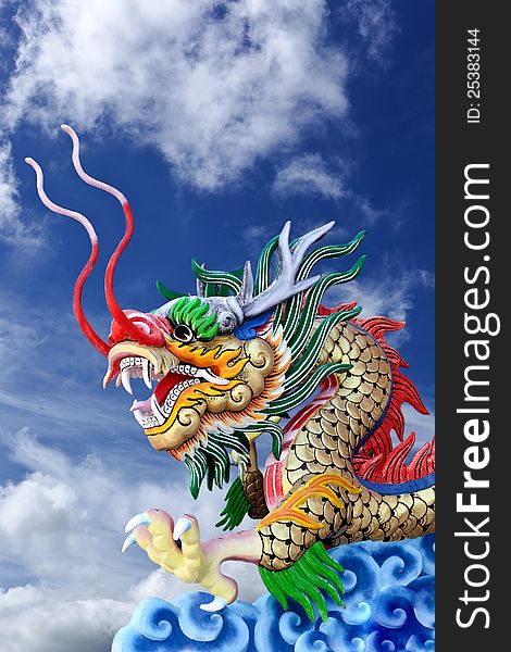 Golden Dragon Statue In  Blue Sky