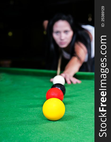 Young girl took aim and prepares to hit the ball. Young girl took aim and prepares to hit the ball