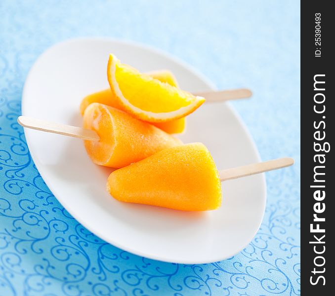 Orange ice lollies, selective focus