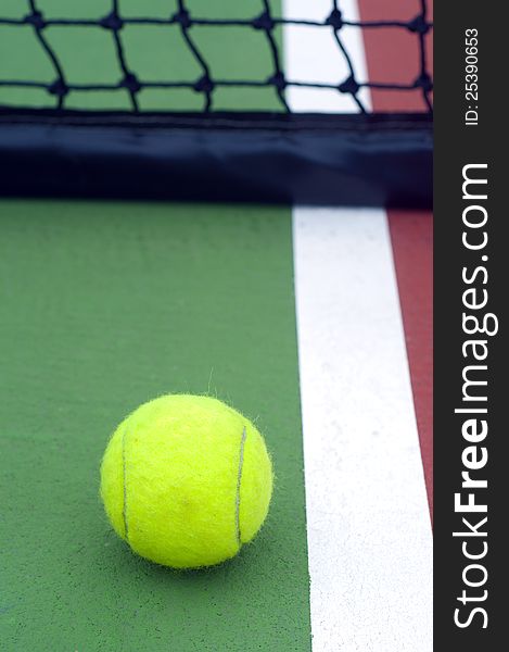 Tennis  ball on line green court