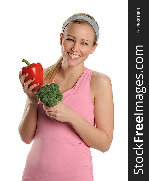 Young Woman holding a red pepper and broccoli isolated on a white background