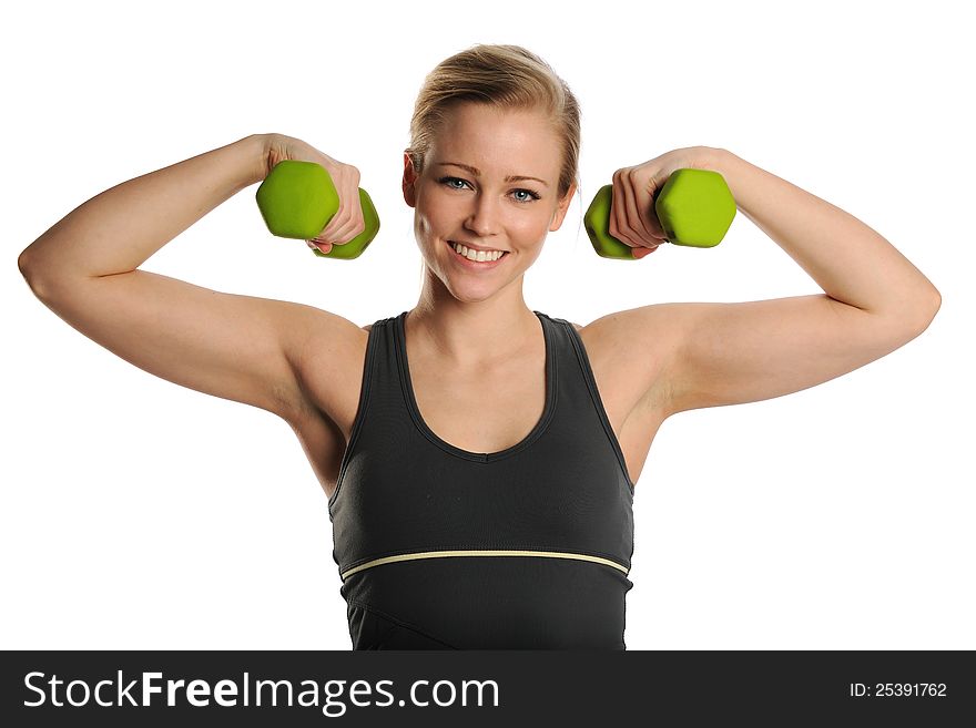Young Blond Woman working out with dumbbells on a white background. Young Blond Woman working out with dumbbells on a white background