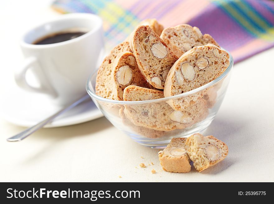 Cantucci cakes and cup of coffee on background. Cantucci cakes and cup of coffee on background