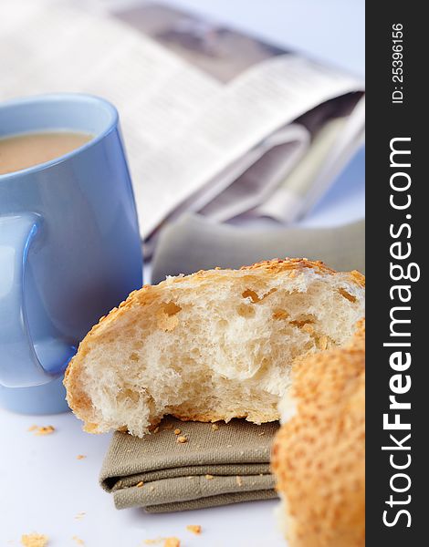 Portion loaf with sesame and coffee on background. Portion loaf with sesame and coffee on background