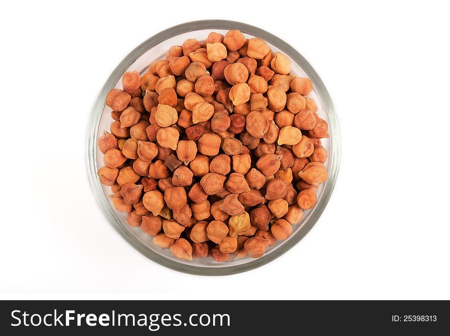 Collection of small chickpeas in transparent glass bowl