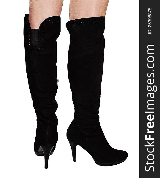 Female boots of black colour on a high heel isolated on a white background