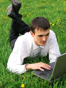 Young Businessman With Laptop Stock Photography
