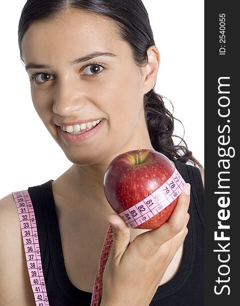 Smiling girl with apple and measuring tape. Smiling girl with apple and measuring tape