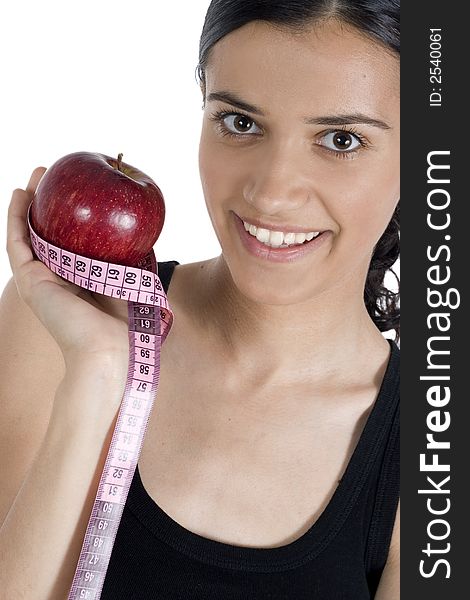 Smiling girl with apple and measuring tape. Smiling girl with apple and measuring tape