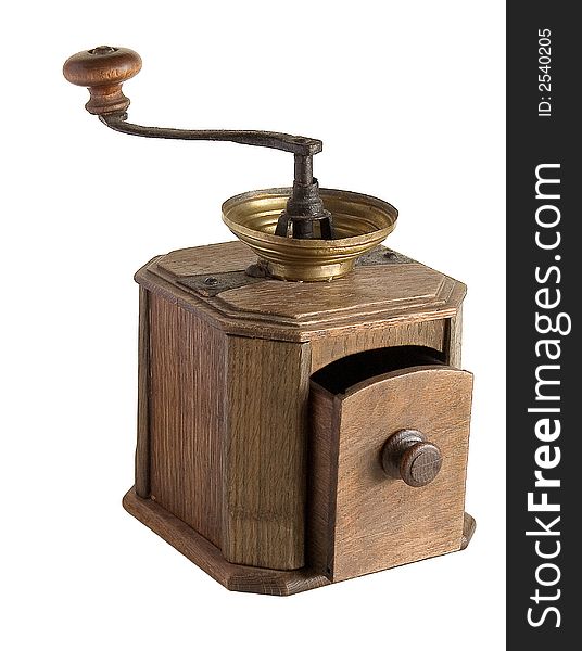 Ancient wooden manual coffee grinder on a light background
