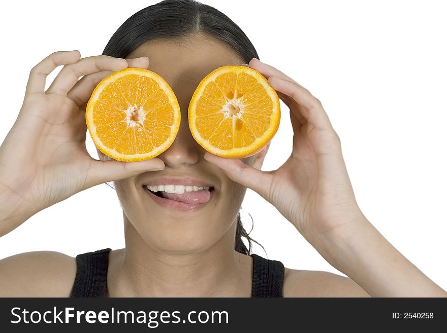 Isolated smiling girl holding orange in front of her eyes. Isolated smiling girl holding orange in front of her eyes