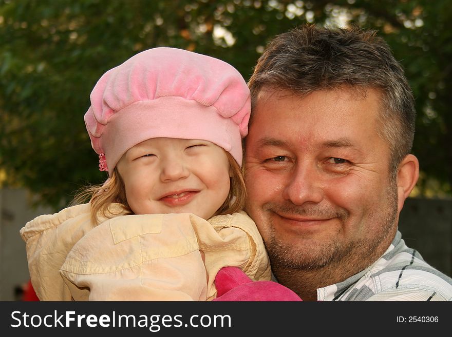Portrait of lucky smiling father and daughter