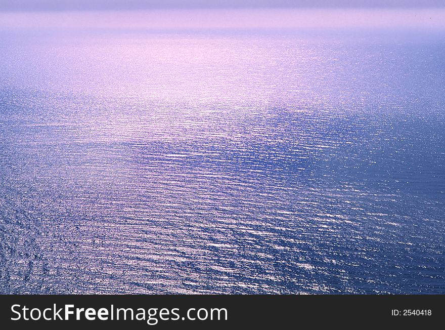 Surface of  sea of  sun covered by beams in  early morning. Surface of  sea of  sun covered by beams in  early morning