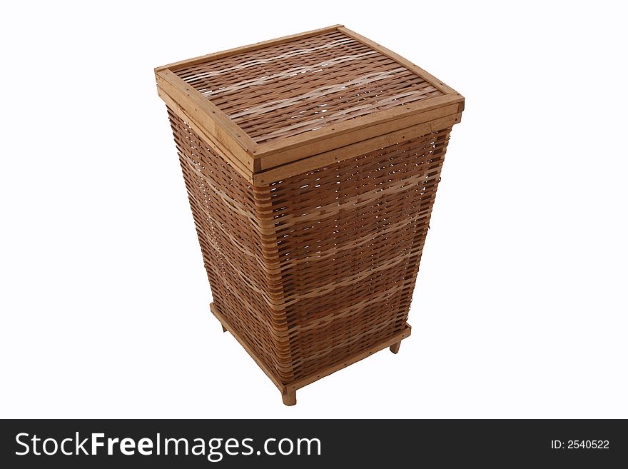 An isolated over white wicker storage basket, brown and light brown in color with wood borders.  Rustic.