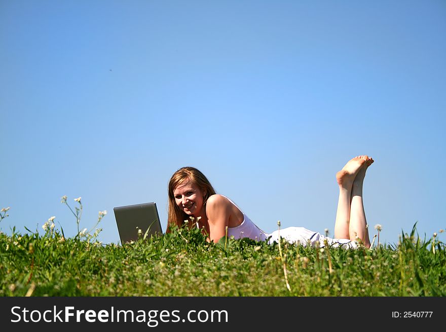 Student girl with notebook on grass. Student girl with notebook on grass