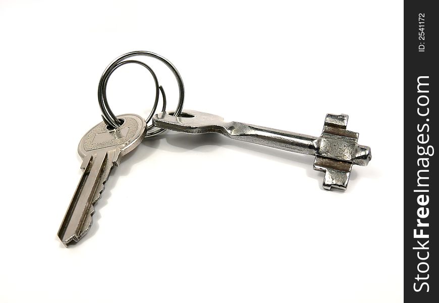 Keys from the house. It is partially visible on a picture and the second key which is connected to the first by ring.