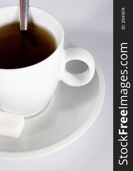 Detail of cup of tea on light gray background