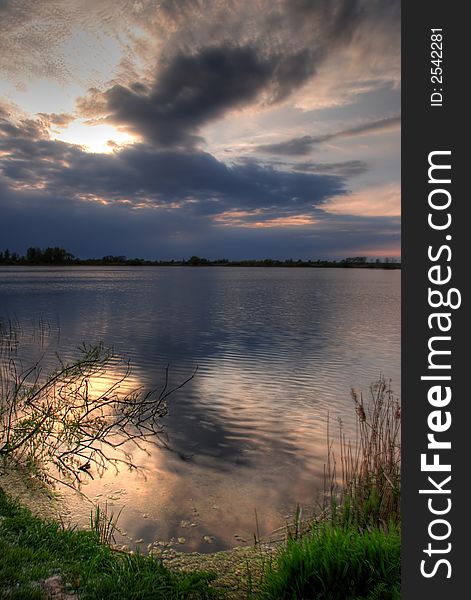 Storm clouds over a lake. Storm clouds over a lake