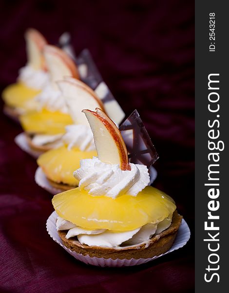 Decorated cake with pineapple chocolate and whipped cream