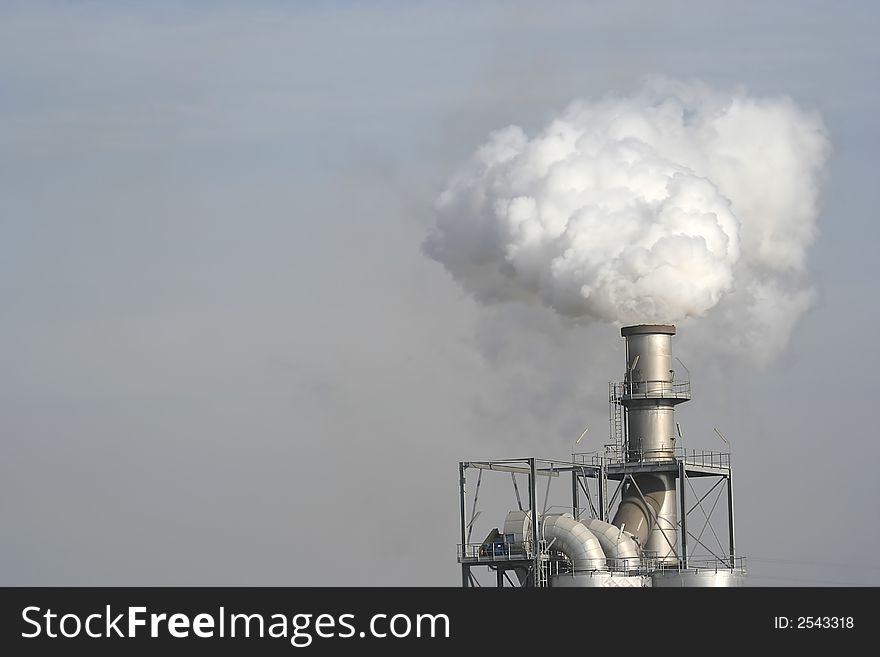 Factory chimney producing a smoke. Factory chimney producing a smoke