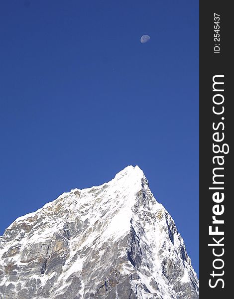Top of the Word – the Himalaya summits and the moon. Top of the Word – the Himalaya summits and the moon.