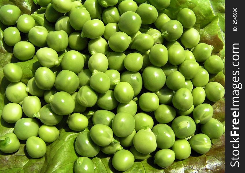 Grains of peas on a cabbage leaf. Grains of peas on a cabbage leaf
