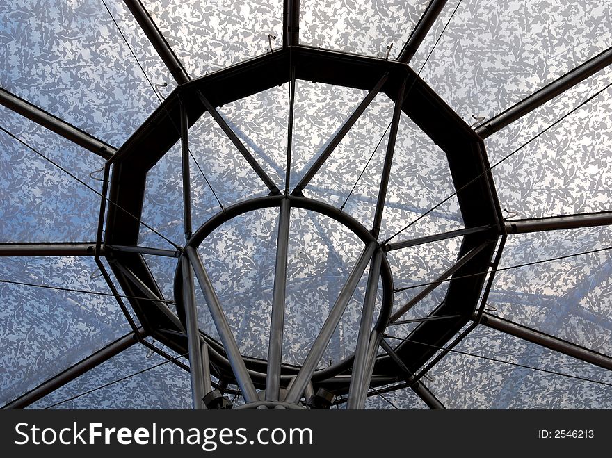 Glass tent and blue skies in the city