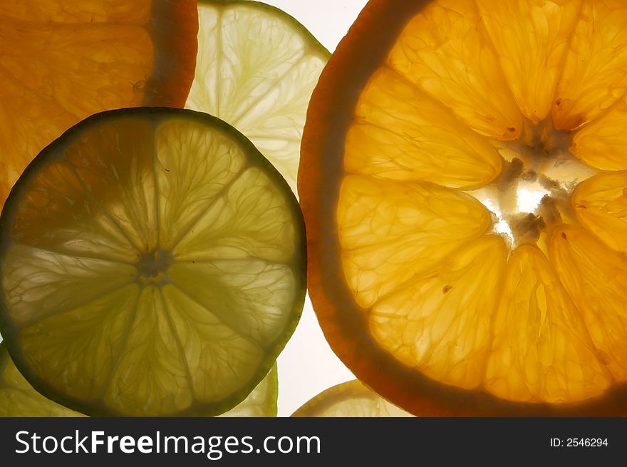 Citrus. slices of orange, lime and lemon on white. Citrus. slices of orange, lime and lemon on white.