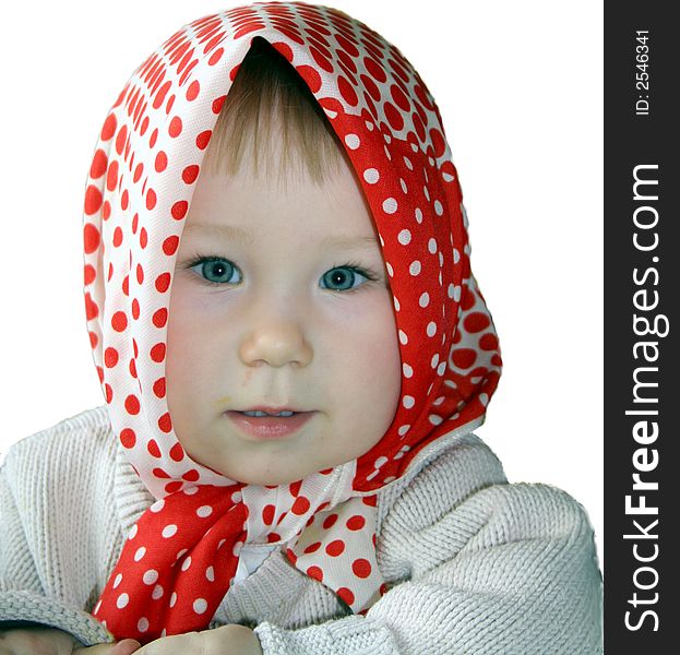 A 1 year old girl in a spotted kerchief. A 1 year old girl in a spotted kerchief